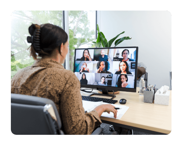 a woman on a zoom meeting with lots of people